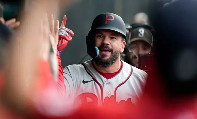 Philadelphia Phillies' Kyle Schwarber celebrates after hitting a home run during the first inning of a baseball game against the Minnesota Twins at the Field of Dreams movie site, Thursday, Aug. 13, 2026, in Dyersville, Iowa. (AP Photo/Charlie Neibergall)