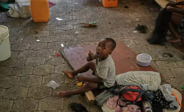 A boy plays at a shelter for families displaced by gang violence in Port-au-Prince, Haiti, Monday, Aug. 17, 2026. (AP Photo/Odelyn Joseph)