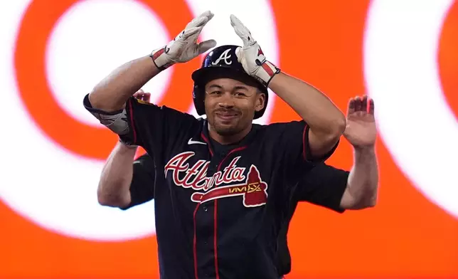 Atlanta Braves' Drake Baldwin celebrates after hitting a double during the fifth inning of a baseball game against the Minnesota Twins Monday, Aug. 17, 2026, in Minneapolis. (AP Photo/Abbie Parr)