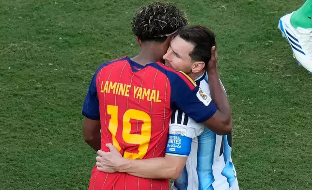 Spain's Lamine Yamal (19) and Argentina's Lionel Messi (10) embrace after during the World Cup final soccer match between Spain and Argentina in East Rutherford, N.J., near New York, Sunday, July 19, 2026. (AP Photo/Seth Wenig)