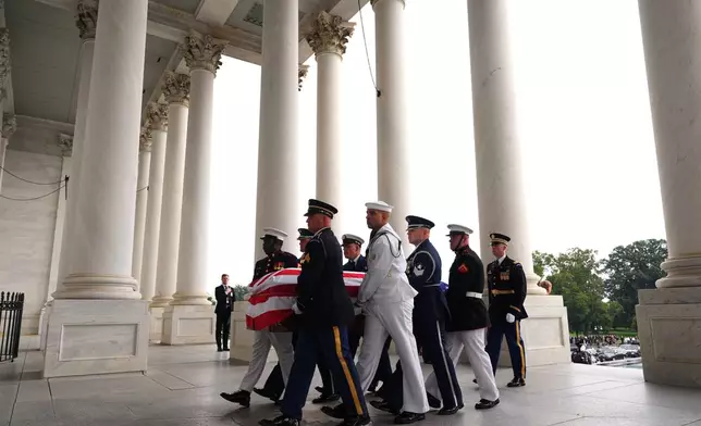 An Armed Forces Body Bearer Team moves the casket of Sen. Lindsey Graham, R-S.C., upon arrival for a Congressional tribute in the Rotunda of the U.S. Capitol, Tuesday, July 28, 2026, in Washington. (AP Photo/Mark Schiefelbein, Pool)