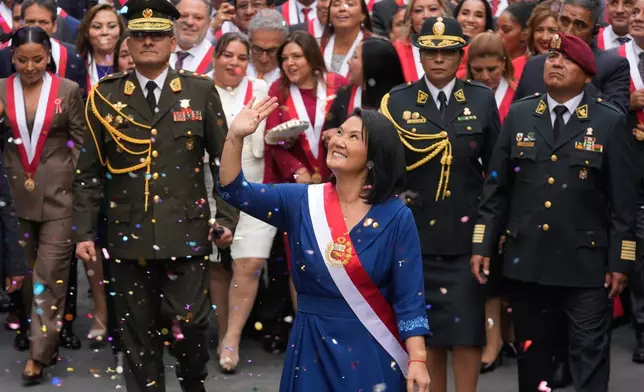 Peru's President Keiko Fujimori walks to the presidential palace after her inauguration in Lima, Peru, Tuesday, July 28, 2026. (AP Photo/Martin Mejia)