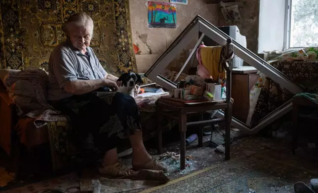 FILE - Elderly Liudmyla Tsapkova sits in her damaged apartment after a Russian missile attack in Kyiv, Ukraine, Thursday, July 2, 2026. (AP Photo/Danylo Antoniuk, File)