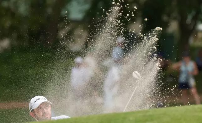 Patrick Cantlay hits out of a bunker on the nineth hole in the final round of the BMW Championship golf tournament, Sunday, Aug. 23, 2026, in St. Louis. (AP Photo/Jeff Roberson)