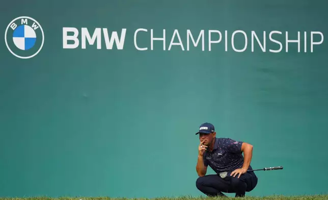 Gary Woodland waits to putt on the 18th green in the final round of the BMW Championship golf tournament, Sunday, Aug. 23, 2026, in St. Louis. (AP Photo/Jeff Roberson)
