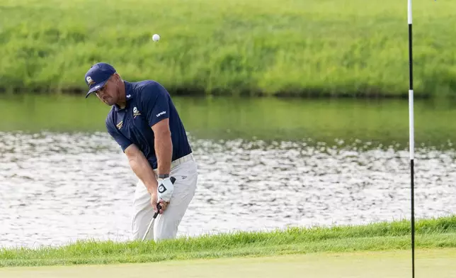 Captain Bryson DeChambeau, of Crushers GC, hits on the 13th green during the final round of LIV Golf Indianapolis, Sunday, Aug. 23, 2026, in Westfield, Ind. (Montana Pritchard/LIV Golf via AP)