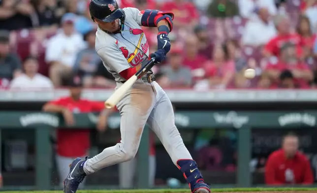 St. Louis Cardinals' Masyn Winn hits a solo home run in the fifth inning of a baseball game against the Cincinnati Reds, Tuesday, Aug. 18, 2026, in Cincinnati. (AP Photo/Carolyn Kaster)
