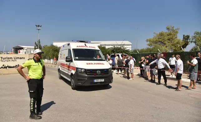 An ambulance arrives at the port of Kyrenia in the Turkish occupied northern part of Cyprus, Sunday, Aug. 30, 2026, after a catamaran-style ferry overturned off the northern coast of Cyprus. (AP Photo)
