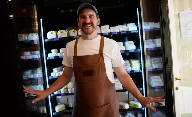 Owner of Le Butter Shop, Erwan Leo, poses in his first shop devoted entirely to butter in Paris, France, Tuesday Aug. 25, 2026. (AP Photo/Christophe Ena)