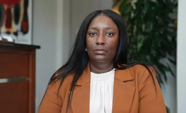 Cassandra Barksdale, who says she was wrongly diagnosed with cancer due to a tissue labelling mistake, poses at her attorney's office in Atlanta, Ga., Thursday, Aug. 6, 2026. (AP Photo/Emilie Megnien)