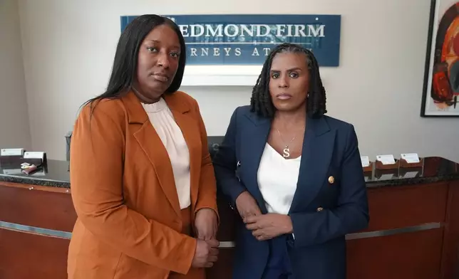 Cassandra Barksdale, left, who says she was wrongly diagnosed with cancer due to a tissue labelling mistake, poses with her lawyer Shannan Young in Atlanta, Ga., Thursday, Aug. 6, 2026. (AP Photo/Emilie Megnien)