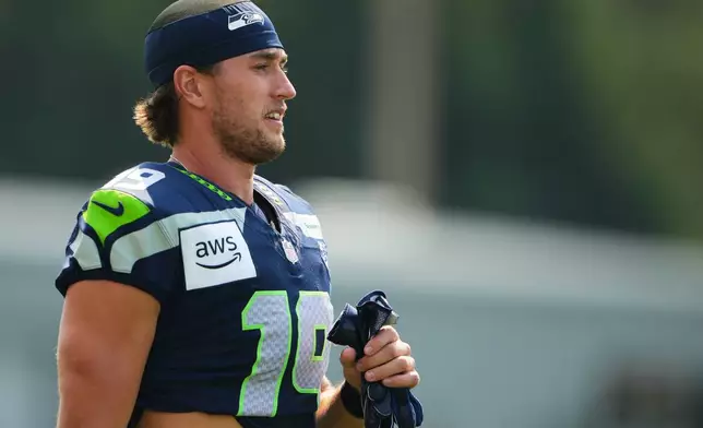 Seattle Seahawks wide receiver Jake Bobo walks onto the field during the NFL football team's training camp, Thursday, Aug. 13, 2026, in Renton, Wash. (AP Photo/Lindsey Wasson)