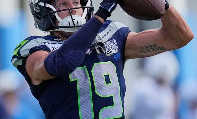 Seattle Seahawks wide receiver Jake Bobo (19) makes a catch during a joint NFL football practice against the Tennessee Titans, Friday, Aug. 21, 2026, in Nashville, Tenn. (AP Photo/George Walker IV)