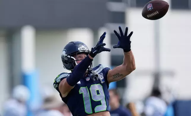 Seattle Seahawks wide receiver Jake Bobo (19) makes a catch during a joint NFL football practice against the Tennessee Titans, Friday, Aug. 21, 2026, in Nashville, Tenn. (AP Photo/George Walker IV)