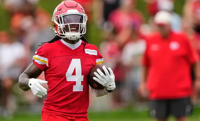 Kansas City Chiefs wide receiver Rashee Rice runs the ball during NFL football training camp Friday, July 31, 2026, in St. Joseph, Mo. (AP Photo/Charlie Riedel)