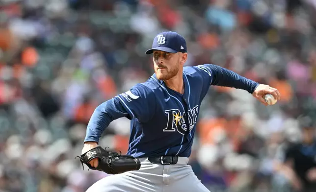Tampa Bay Rays pitcher Cam Booser throws against the Baltimore Orioles in the seventh inning of a baseball game Sunday, Aug. 23, 2026, in Baltimore. (AP Photo/Gail Burton)