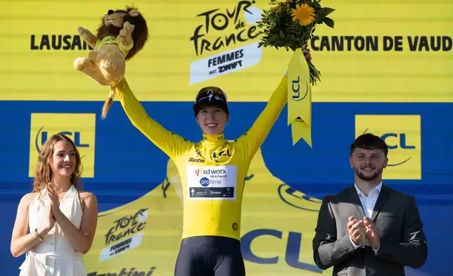 Netherlands' Lorena Wiebes of team SD Worx Protime celebrates on the podium after winning the first stage of the Women's Tour de France cycling race (Tour de France Femmes), in Lausanne, Switzerland, Saturday, Aug. 1, 2026. (Jean-Christophe Bott/Keystone via AP)
