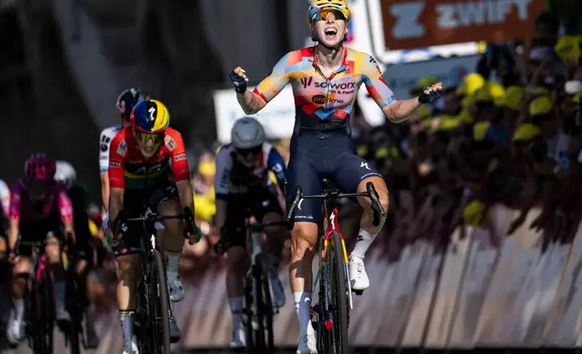 Netherlands' Lorena Wiebes of team SD Worx Protime celebrates after taking the win in the first stage of the Women's Tour de France cycling race (Tour de France Femmes), in Lausanne, Switzerland, Saturday, Aug. 1, 2026. (Jean-Christophe Bott/Keystone via AP)