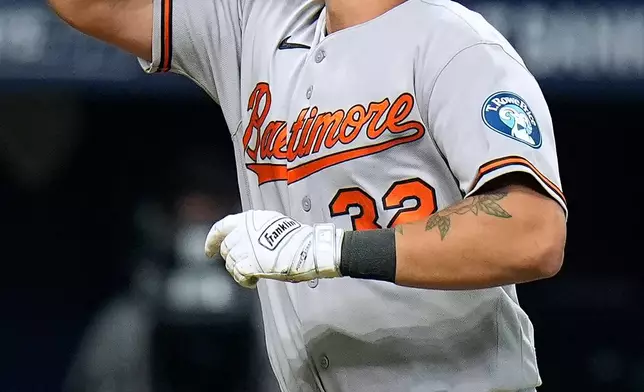 Baltimore Orioles' Christian Encarnacion-Strand (32) celebrates his home run off Tampa Bay Rays pitcher Ian Seymour during the sixth inning of a baseball game Saturday, Aug. 15, 2026, in St. Petersburg, Fla. (AP Photo/Chris O'Meara)