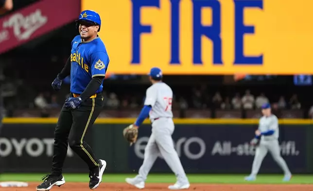 Seattle Mariners' Leo Rivas reacts to hitting a walk-off RBI single in the 10th inning to win a baseball game against the Chicago Cubs, Friday, Aug. 21, 2026, in Seattle. (AP Photo/Lindsey Wasson)