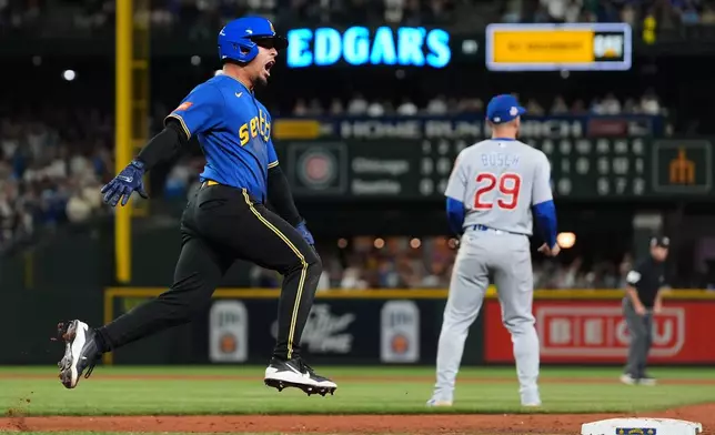 Seattle Mariners' Leo Rivas reacts to hitting a walk-off RBI single in the 10th inning to win a baseball game against the Chicago Cubs, Friday, Aug. 21, 2026, in Seattle. (AP Photo/Lindsey Wasson)