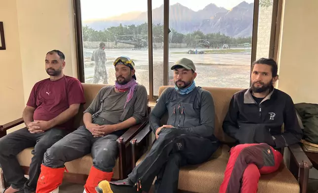 In this photo released by the Alpine Club of Pakistan on Friday, July 31, 2026, members of a mountaineers rescue team prepare to depart from an airbase on a search operation for climbers missing after an avalanche on Pakistan's Broad Peak, in Skardu, in Gilgit-Baltistan's region, in northern Pakistan. (Alpine Club of Pakistan via AP)
