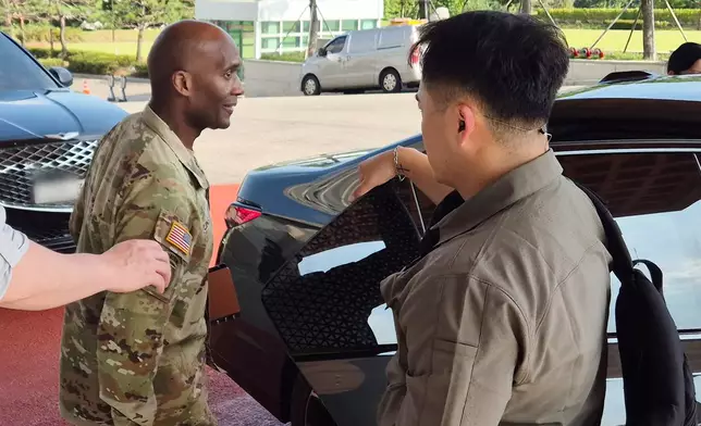 Gen. Xavier Brunson, commander of U.S. Forces Korea, left, leaves the Defense Ministry in Seoul, South Korea, Tuesday, Aug. 18, 2026. (Kim Chul-sun/Yonhap via AP)