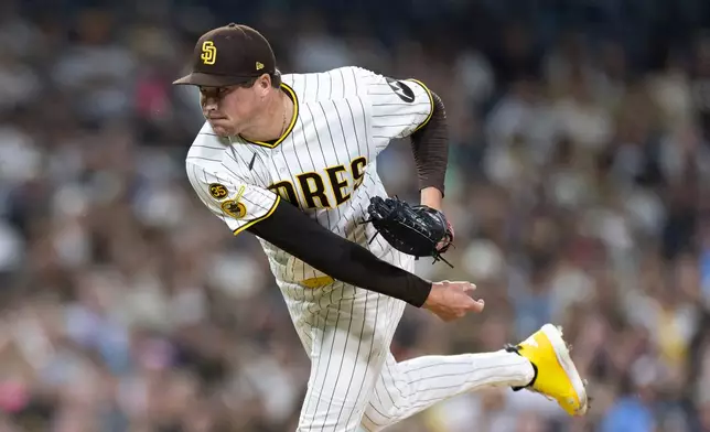 San Diego Padres pitcher Mason Miller works against a Milwaukee Brewers batter in the ninth inning of a baseball game Monday, Aug. 10, 2026, in San Diego. (AP Photo/Karl Anderson)