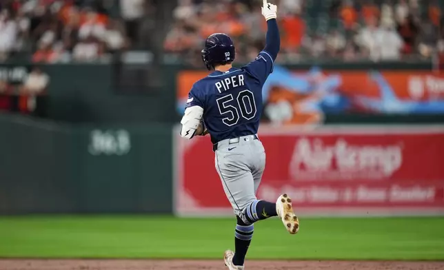 Tampa Bay Rays' Kenny Piper (50) rounds the bases after hitting a two-run home run during the second inning of a baseball game against the Baltimore Orioles, Friday, Aug. 21, 2026, in Baltimore. (AP Photo/Stephanie Scarbrough)