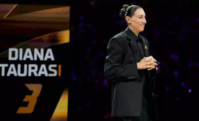 Retired WNBA Phoenix Mercury basketball player Diana Taurasi is honored during a halftime Ring of Honor ceremony Sunday, Aug. 16, 2026, in Phoenix. (AP Photo/Ross D. Franklin)