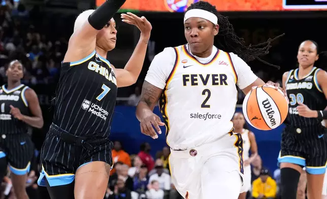 Chicago Sky guard-forward DiJonai Carrington (7) guards against Indiana Fever forward Myisha Hines-Allen (2) during the first half of a WNBA basketball game Sunday, Aug. 23, 2026, in Chicago. (AP Photo/Nam Y. Huh)