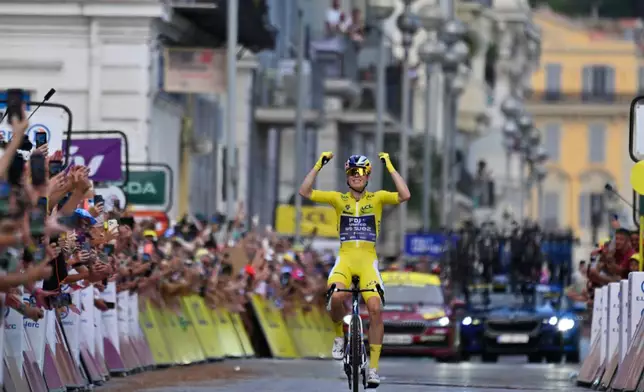 Netherlands' Demi Vollering celebrates as she crosses the finish line to win the ninth stage of the Women's Tour de France cycling race (Tour de France Femmes) in Nice, France, Sunday, Aug. 9, 2026. (AP Photo/Philippe Magoni)