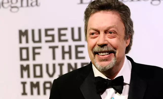 FILE - Tim Curry attends the Museum of the Moving Image salute to Alec Baldwin in New York on Feb. 28, 2011. (AP Photo/Peter Kramer, File)