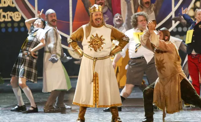 FILE - Tim Curry, center, appears with cast members from nominated Broadway productions at the 2005 Tony Awards at Radio City Music Hall in New York on June 5, 2005. (AP Photo/Kathy Willens, File)