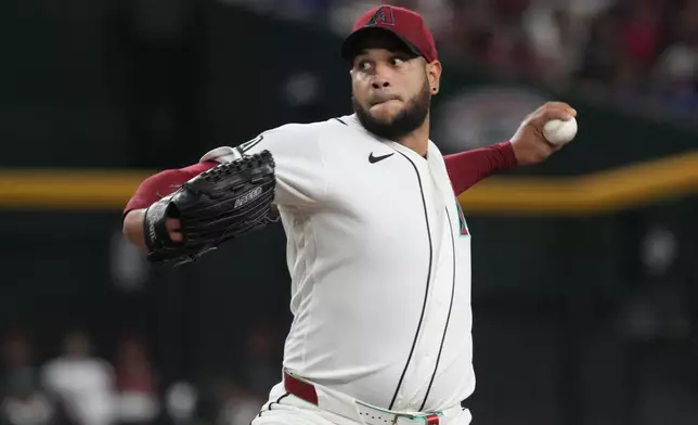 Arizona Diamondbacks pitcher Eduardo Rodriguez throws against the Los Angeles Dodgers in the first inning of a baseball game, Sunday, Aug 9, 2026, in Phoenix. (AP Photo/Rick Scuteri)