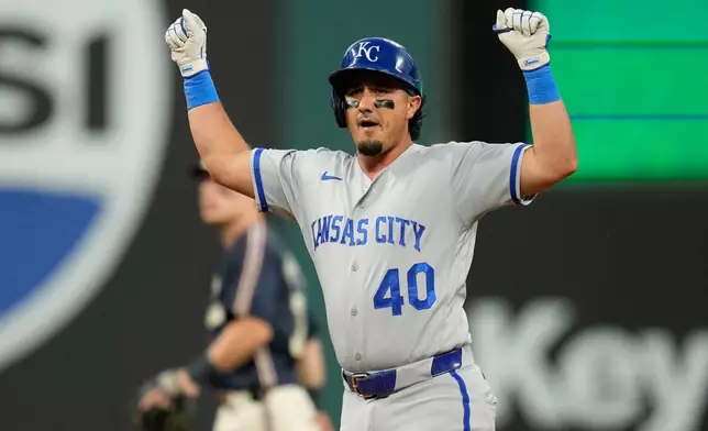 Kansas City Royals' Josh Rojas (40) gestures from second base after hitting a double in the fourth inning of a baseball game against the Cleveland Guardians in Cleveland, Friday, Aug. 28, 2026. (AP Photo/Sue Ogrocki)