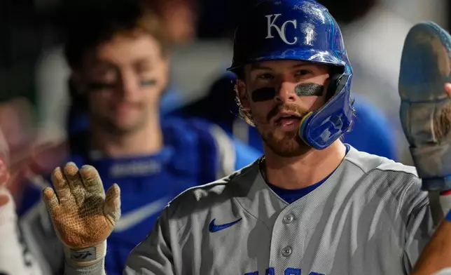 Kansas City Royals' Bobby Witt Jr. celebrates in the dugout after scoring in the fifth inning of a baseball game against the Cleveland Guardians in Cleveland, Friday, Aug. 28, 2026. (AP Photo/Sue Ogrocki)