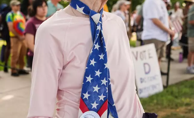 A demonstrator wears an American flag tie during the March on Washington, Friday, Aug. 28, 2026, near the Lincoln Memorial in Washington. (AP Photo/Julia Demaree Nikhinson)