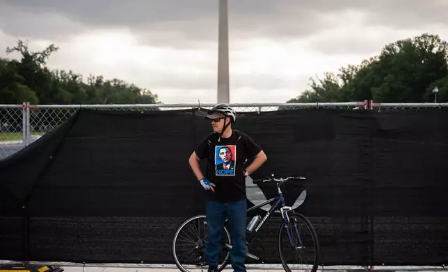 A demonstrator wears a shirt depicting former President Barack Obama in front of fencing surrounding the Lincoln Memorial Reflecting Pool, during the March on Washington, Friday, Aug. 28, 2026, in Washington. (AP Photo/Julia Demaree Nikhinson)