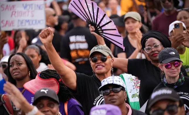 Demonstrators listen to speakers during the March on Washington, Friday, Aug. 28, 2026, near the Lincoln Memorial in Washington. (AP Photo/Julia Demaree Nikhinson)