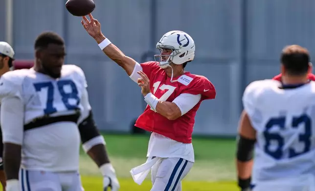 Indianapolis Colts quarterback Daniel Jones (17) throws a pass during a NFL football training camp, Tuesday, Aug. 11, 2026, in Foxborough, Mass. (AP Photo/Charles Krupa)