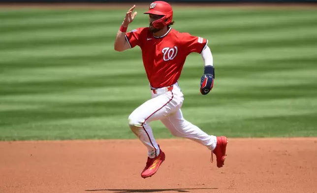 Washington Nationals' Dylan Crews runs to third base on a single by Jorbit Vivas during the second inning of a baseball game against the Cincinnati Reds, Sunday, Aug. 9, 2026, in Washington. (AP Photo/Nick Wass)