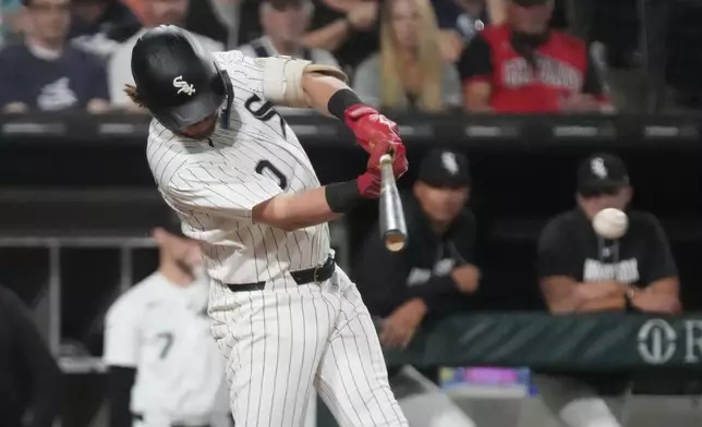Chicago White Sox's Chase Meidroth hits a one-run single against the Texas Rangers during the fourth inning of a baseball game Tuesday, Aug. 25, 2026, in Chicago. (AP Photo/David Banks)