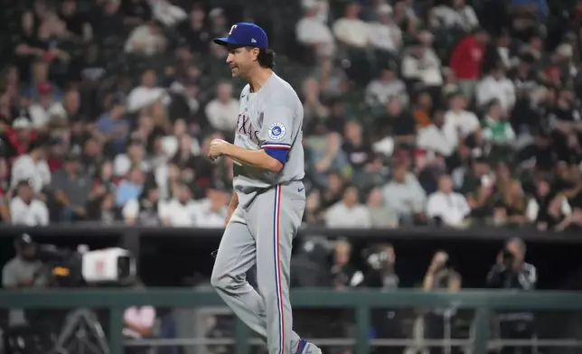 Texas Rangers pitcher Jacob Degrom leaves the game against the Chicago White Sox during the fourth inning of a baseball game Tuesday, Aug. 25, 2026, in Chicago. (AP Photo/David Banks)