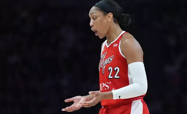 Las Vegas Aces center A'ja Wilson reacts after being called for a kickball during the first half of a WNBA basketball game against the Minnesota Lynx in Minneapolis, Saturday, Aug. 8, 2026. (AP Photo/Abbie Parr)