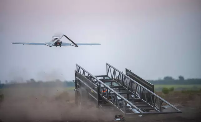 A Ukrainian "Chaklun" long-range strike drone takes off from a mobile launcher during an operational launch targeting Russian military installations in Crimea, from an undisclosed location in Ukraine on Thursday, Aug. 6, 2026. (AP Photo/Dan Bashakov)