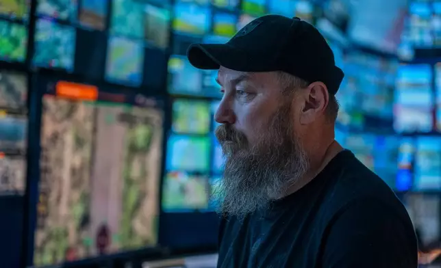 Maj. Robert "Magyar" Brovdi stands in the control room during a long-range unmanned aerial vehicle operation targeting Russian positions in an undisclosed location in Ukraine on Friday, Aug. 7, 2026. (AP Photo/Dan Bashakov)
