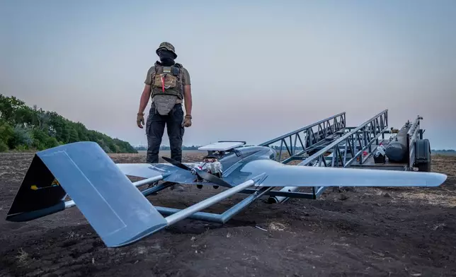 A Ukrainian serviceman prepares a "Chaklun" strike drone used for deep-strike operations against Russian positions in Crimea, in an undisclosed location in Ukraine on Thursday, Aug. 6, 2026. (AP Photo/Dan Bashakov)