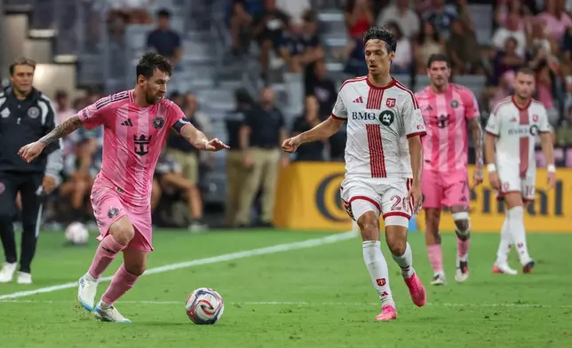 Inter Miami forward Leo Messi (10) controls the ball against Toronto FC forward Dániel Sallói (20) during the first half of an MLS soccer game on Saturday, Aug. 22, 2026, in Miami. (AP Photo/David Santiago)