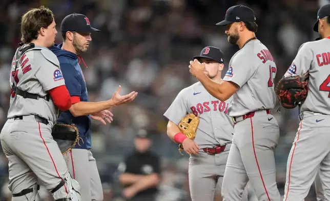 Boston Red Sox pitcher Patrick Sandoval heads to the dugout while being pulled by Boston Red Sox manager Chad Tracy during the sixth inning of a baseball game against the New York Yankees, Friday, Aug. 28, 2026, in New York. (AP Photo/Yuki Iwamura)